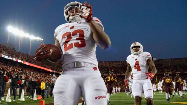 MINNEAPOLIS, MN - NOVEMBER 25: Jonathan Taylor #23 and A.J. Taylor #4 of the Wisconsin Badgers celebrate a touchdown against the Minnesota Golden Gophers by Taylor during the fourth quarter of the game on November 25, 2017 at TCF Bank Stadium in Minneapolis, Minnesota. The Badgers defeated the Golden Gophers 31-0. (Photo by Hannah Foslien/Getty Images)