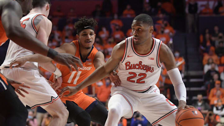 Feb 24, 2022; Champaign, Illinois, USA; Ohio State Buckeyes guard Malaki Branham (22) drives the ball past Illinois Fighting Illini guard Alfonso Plummer (11) during the second half at State Farm Center. Mandatory Credit: Ron Johnson-USA TODAY Sports