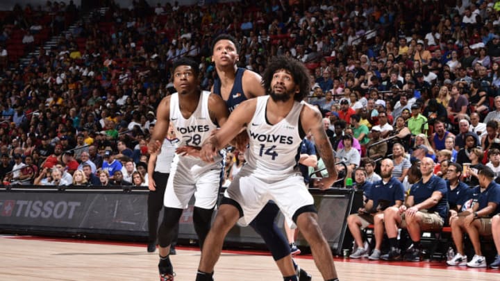 LAS VEGAS, NV - JULY 15: Tyus Battle #28 of the Minnesota Timberwolves and Jordan Murphy #14 of the Minnesota Timberwolves fight for the rebound against the Memphis Grizzlies during the Finals of the Las Vegas Summer League on July 15, 2019 at the Thomas & Mack Center in Las Vegas, Nevada. NOTE TO USER: User expressly acknowledges and agrees that, by downloading and/or using this photograph, user is consenting to the terms and conditions of the Getty Images License Agreement. Mandatory Copyright Notice: Copyright 2019 NBAE (Photo by David Dow/NBAE via Getty Images)