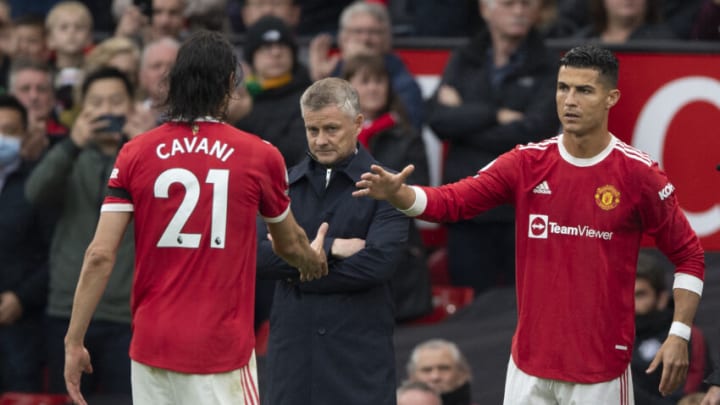 MANCHESTER, ENGLAND - OCTOBER 02: Edinson Cavani of Manchester United is replaced by Cristiano Ronaldo as Manchester United Manager Ole Gunnar Solskjær looks on during the Premier League match between Manchester United and Everton at Old Trafford on October 02, 2021 in Manchester, England. (Photo by Visionhaus/Getty Images)