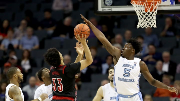 CHARLOTTE, NORTH CAROLINA – MARCH 14: Nassir Little #5 of the North Carolina Tar Heels defends a shot from Jordan Nwora #33 of the Louisville Cardinals during their game in the quarterfinal round of the 2019 Men’s ACC Basketball Tournament at Spectrum Center on March 14, 2019 in Charlotte, North Carolina. (Photo by Streeter Lecka/Getty Images)