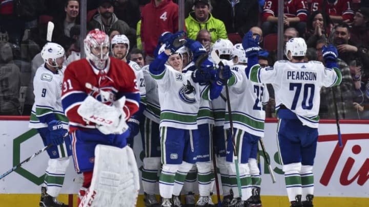 MONTREAL, QC - FEBRUARY 25: The Vancouver Canucks celebrate their victory against the Montreal Canadiens during overtime at the Bell Centre on February 25, 2020 in Montreal, Canada. The Vancouver Canucks defeated the Montreal Canadiens 4-3 in overtime. (Photo by Minas Panagiotakis/Getty Images)