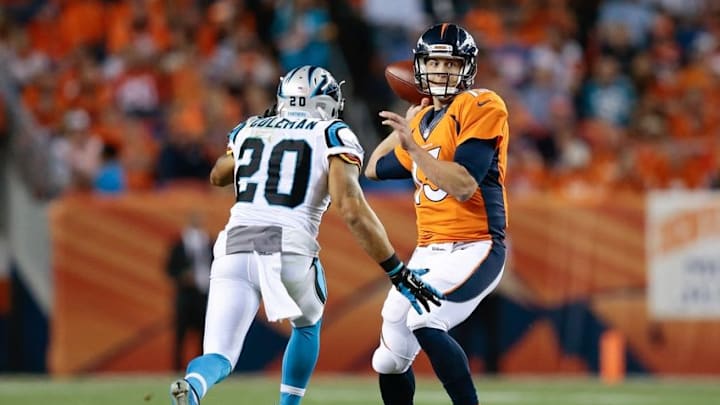 Sep 8, 2016; Denver, CO, USA; Denver Broncos quarterback Trevor Siemian (13) passes the ball under pressure from Carolina Panthers free safety Kurt Coleman (20) in the fourth quarter at Sports Authority Field at Mile High. Mandatory Credit: Isaiah J. Downing-USA TODAY Sports