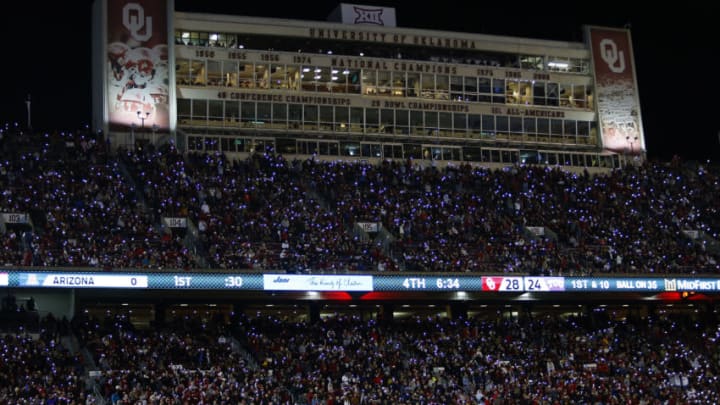 NORMAN, OK - NOVEMBER 23: Oklahoma Sooners fans pull out their phone flashlights during a timeout against the TCU Horned Frogs on November 23, 2019 at Gaylord Family Oklahoma Memorial Stadium in Norman, Oklahoma. OU held on to win 28-24. (Photo by Brian Bahr/Getty Images)