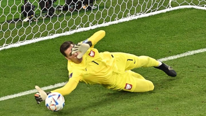 Poland's Wojciech Szczesny stops a penalty by Saudi Arabia's Salem Al-Dawsari during the Qatar 2022 World Cup Group C match. (Photo by MANAN VATSYAYANA/AFP via Getty Images)