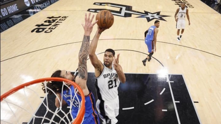 May 10, 2016; San Antonio, TX, USA; San Antonio Spurs power forward Tim Duncan (21) shoots the ball over Oklahoma City Thunder center Steven Adams (12) in game five of the second round of the NBA Playoffs at AT&T Center. Mandatory Credit: Soobum Im-USA TODAY Sports