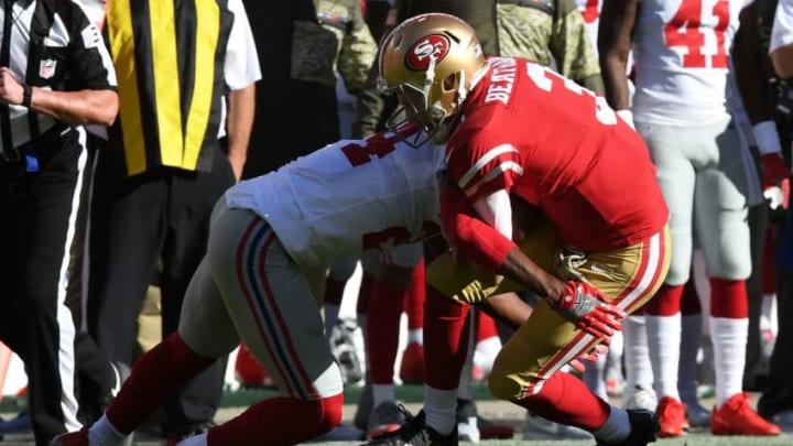 SANTA CLARA, CA - NOVEMBER 12: C.J. Beathard #3 of the San Francisco 49ers is hit by Eli Apple #24 of the New York Giants during their NFL game at Levi's Stadium on November 12, 2017 in Santa Clara, California. (Photo by Thearon W. Henderson/Getty Images)