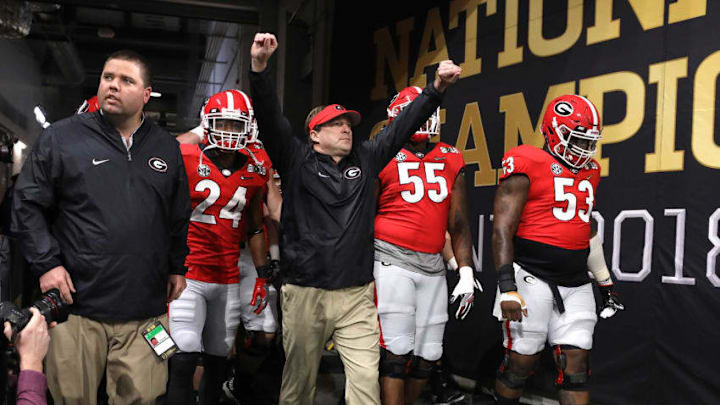 ATLANTA, GA - JANUARY 08: Head coach Kirby Smart of the Georgia Bulldogs walks out of the tunnel with his players during warm ups prior to the game against the Alabama Crimson Tide in the CFP National Championship presented by AT