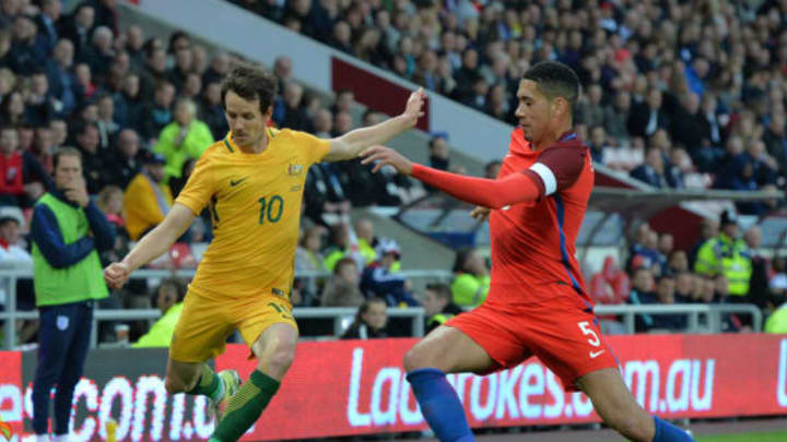 SUNDERLAND, ENGLAND – MAY 27: Robbie Kruse of Australia takes on Chris Smalling of England during the International Friendly match between England and Australia at Stadium of Light on May 27, 2016 in Sunderland, England. (Photo by Mark Runnacles/Getty Images)