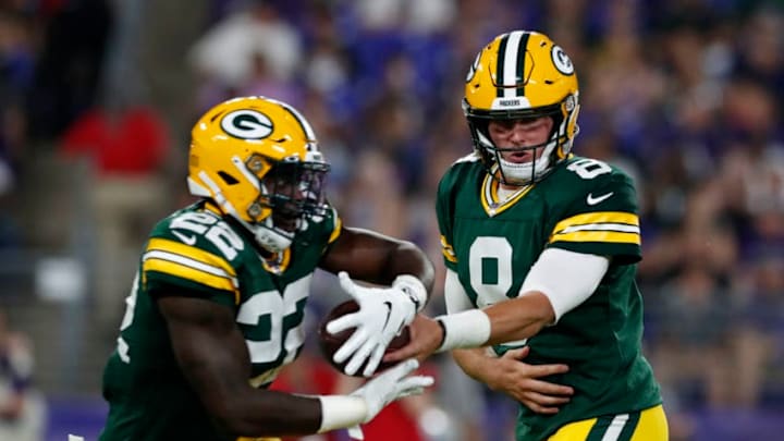 BALTIMORE, MARYLAND - AUGUST 15: Tim Boyle #8 of the Green Bay Packers hands the ball off to Dexter Williams #22 in the first half of a preseason game against the Baltimore Ravens at M&T Bank Stadium on August 15, 2019 in Baltimore, Maryland. (Photo by Todd Olszewski/Getty Images)