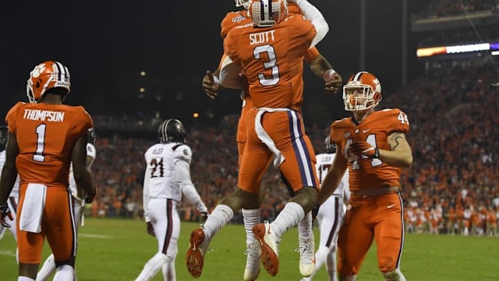 Nov 26, 2016; Clemson, SC, USA; Clemson Tigers wide receiver Artavis Scott (3) celebrates with quarterback Deshaun Watson (4) after scoring a touchdown during the third quarter against the South Carolina Gamecocks at Clemson Memorial Stadium. Mandatory Credit: Tommy Gilligan-USA TODAY Sports