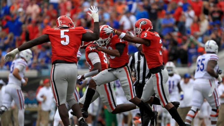 JACKSONVILLE, FL - OCTOBER 27: Tyrique McGhee #26 of the Georgia Bulldogs celebrates an interception during a game against the Florida Gators at TIAA Bank Field on October 27, 2018 in Jacksonville, Florida. (Photo by Mike Ehrmann/Getty Images)
