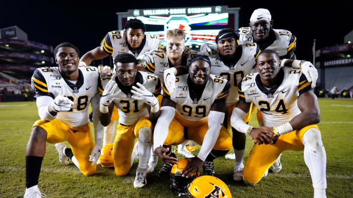 COLUMBIA, SOUTH CAROLINA – NOVEMBER 09: Appalachian State Mountaineers players pose in front of the scoreboard after winning their game against the South Carolina Gamecocks at Williams-Brice Stadium on November 09, 2019 in Columbia, South Carolina. (Photo by Jacob Kupferman/Getty Images)