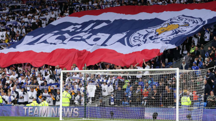 CARDIFF, WALES - NOVEMBER 03: Leicester City fans commemorate Vichai Srivaddhanaprabha by holding up scarfs and signs during the Premier League match between Cardiff City and Leicester City at Cardiff City Stadium on November 03, 2018 in Cardiff, United Kingdom. (Photo by Richard Heathcote/Getty Images)