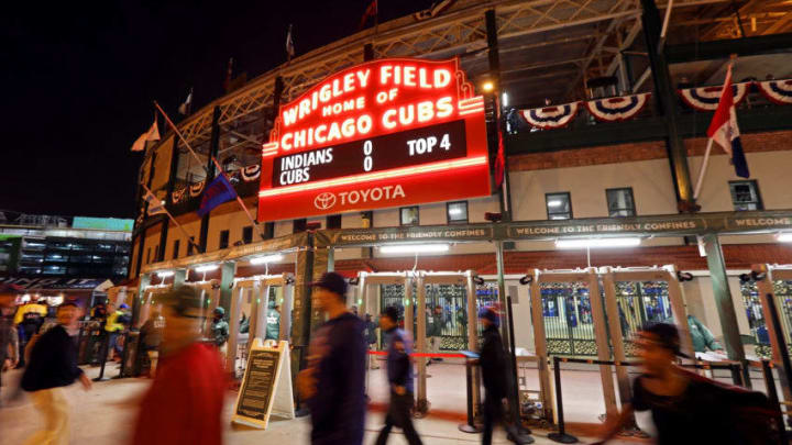 CHICAGO, IL - OCTOBER 28: People walk past the sign outside of Wrigley Field during Game Three of the 2016 World Series between the Chicago Cubs and the Cleveland Indians on October 28, 2016 in Chicago, Illinois. (Photo by Michael Heiman/Getty Images)