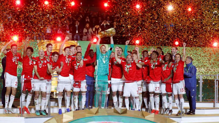 BERLIN, GERMANY – MAY 25: Bayern Munich’s players celebrate at the stage with the trophy after the German DFB Cup final soccer match between FC Bayern Munich and RB Leipzig at the Olympic Stadium in Berlin, Germany on 24 May 2019.(Photo by Abdulhamid Hosbas/Anadolu Agency/Getty Images)