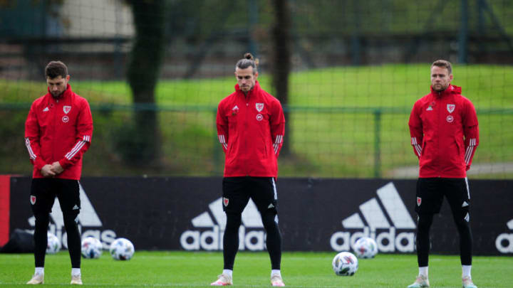 CARDIFF, WALES - NOVEMBER 11: (L-R) Ben Davies, Gareth Bale and Chris Gunter observe Remembrance Day during the Wales Training. (Photo by Athena Pictures/Getty Images)