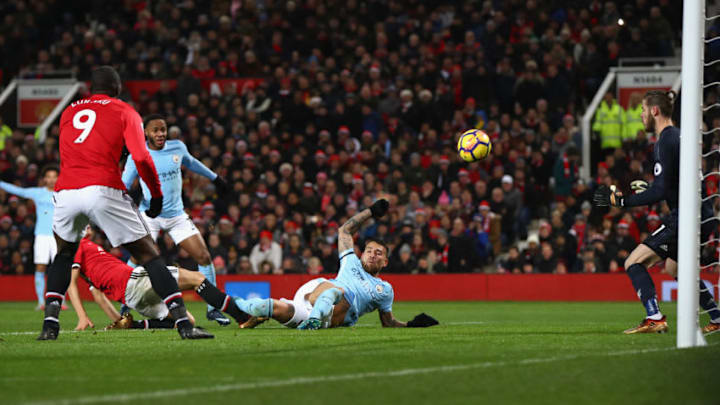 MANCHESTER, ENGLAND - DECEMBER 10: Nicolas Otamendi of Manchester City scores the 2nd Manchester City goal during the Premier League match between Manchester United and Manchester City at Old Trafford on December 10, 2017 in Manchester, England. (Photo by Michael Steele/Getty Images)