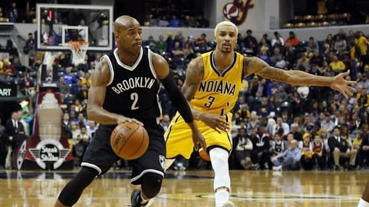 Dec 18, 2015; Indianapolis, IN, USA; Brooklyn Nets guard Jarrett Jack (2) drives to the basket against Indiana Pacers guard George Hill (3) at Bankers Life Fieldhouse. Indiana defeats Brooklyn 104-97. Mandatory Credit: Brian Spurlock-USA TODAY Sports