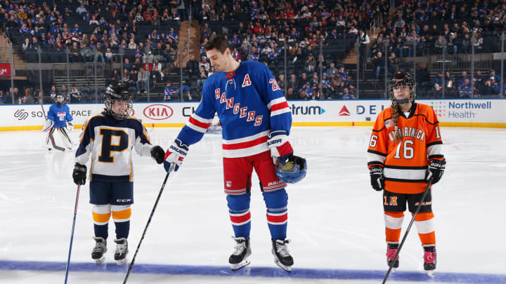 NEW YORK, NY – NOVEMBER 10: Chris Kreider #20 of the New York Rangers greets two youth hockey members on the blue line prior to the game against the Florida Panthers at Madison Square Garden on November 10, 2019 in New York City. (Photo by Jared Silber/NHLI via Getty Images)