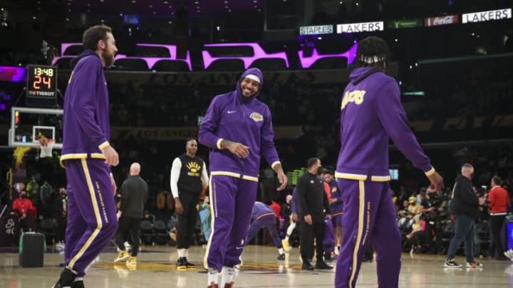 LOS ANGELES, CALIFORNIA - DECEMBER 21: Jay Huff #30, Carmelo Anthony #7, and Jemerrio Jones #50 of the Los Angeles Lakers warm up before the game against the Phoenix Suns at Staples Center on December 21, 2021 in Los Angeles, California. NOTE TO USER: User expressly acknowledges and agrees that, by downloading and/or using this photograph, User is consenting to the terms and conditions of the Getty Images License Agreement. (Photo by Meg Oliphant/Getty Images )