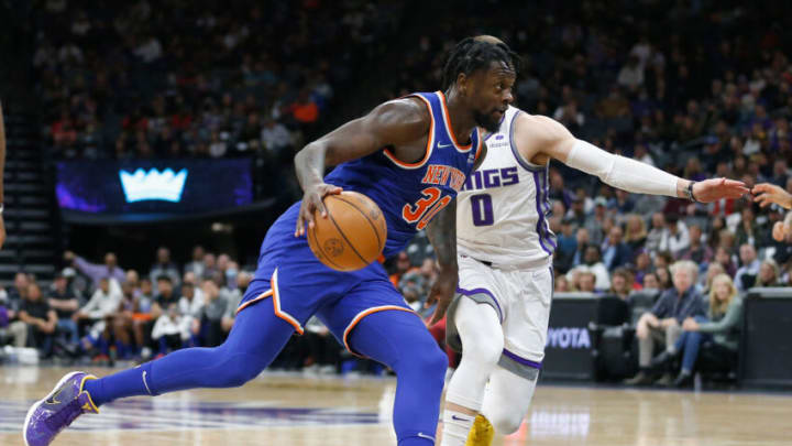 SACRAMENTO, CALIFORNIA - MARCH 07: Julius Randle #30 of the New York Knicks drives to the basket against Donte DiVincenzo #0 of the Sacramento Kings in the third quarter at Golden 1 Center on March 07, 2022 in Sacramento, California. NOTE TO USER: User expressly acknowledges and agrees that, by downloading and/or using this photograph, User is consenting to the terms and conditions of the Getty Images License Agreement (Photo by Lachlan Cunningham/Getty Images)