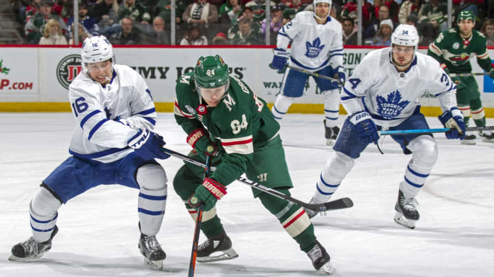 ST. PAUL, MN - DECEMBER 01: Mitch Marner #16 of the Toronto Maple Leafs and Mikael Granlund #64 of the Minnesota Wild battle for the puck during a game at Xcel Energy Center on December 1, 2018 in St. Paul, Minnesota.(Photo by Bruce Kluckhohn/NHLI via Getty Images)