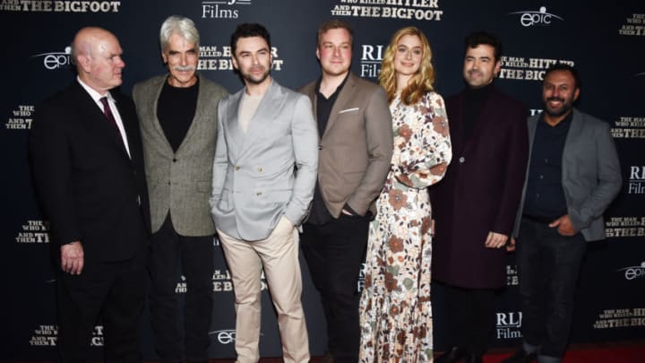 HOLLYWOOD, CALIFORNIA - FEBRUARY 04: Larry Miller, Sam Elliott, Aidan Turner, Robert D. Krzykowski, Caitlin Fitzgerald, Ron Livingston and Rizwan Manji arrive at RLJE Films' "The Man Who Killed Hitler And Then Bigfoot" premiere at ArcLight Hollywood on February 04, 2019 in Hollywood, California. (Photo by Amanda Edwards/Getty Images)