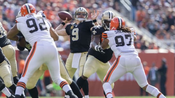 CLEVELAND, OH - SEPTEMBER 14: Quarterback Drew Brees #9 of the New Orleans Saints passes under pressure from defensive end Desmond Bryant #92 and outside linebacker Jabaal Sheard #97 of the Cleveland Browns during the second half at FirstEnergy Stadium on September 14, 2014 in Cleveland, Ohio. (Photo by Jason Miller/Getty Images)