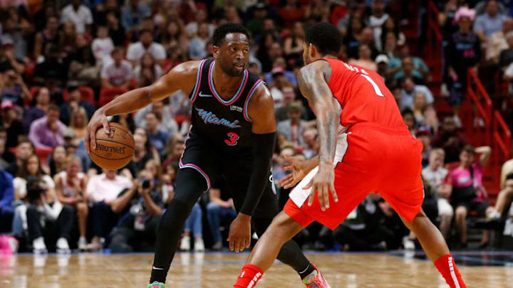 Dwyane Wade #3 of the Miami Heat guarded by Trevor Ariza #1 of the Washington Wizards (Photo by Michael Reaves/Getty Images)