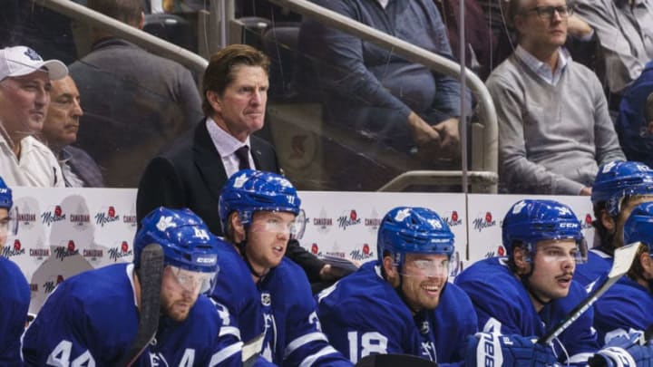 TORONTO, ON - OCTOBER 10: Mike Babcock head coach of the Toronto Maple Leafs watches on against the Tampa Bay Lightning during the second period at the Scotiabank Arena on October 10, 2019 in Toronto, Ontario, Canada. (Photo by Mark Blinch/NHLI via Getty Images)