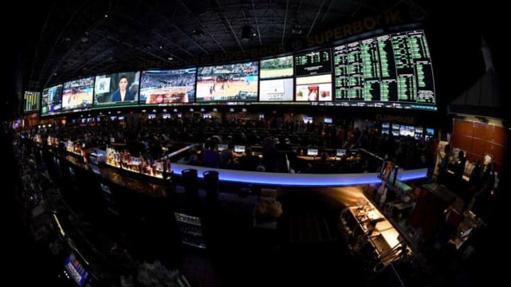 LAS VEGAS, NV - MARCH 15: (EDITORS NOTE: This image was shot with a fisheye lens.) Guests attend a viewing party for the NCAA Men's College Basketball Tournament inside the 25,000-square-foot Race & Sports SuperBook at the Westgate Las Vegas Resort & Casino which features 4,488-square-feet of HD video screens on March 15, 2018 in Las Vegas, Nevada. (Photo by Ethan Miller/Getty Images)