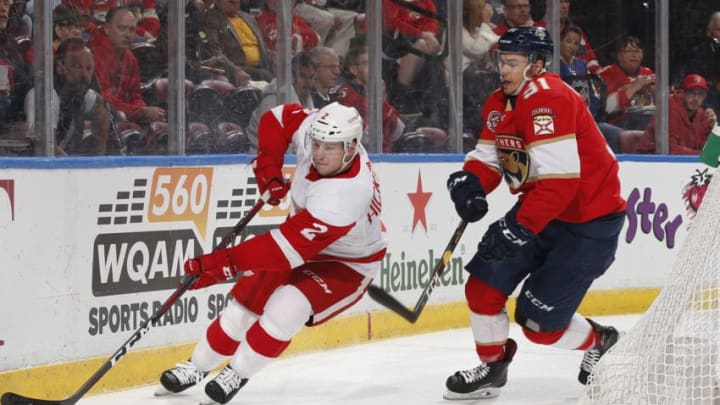 SUNRISE, FL - OCTOBER 20: Juho Lammikko #91 of the Florida Panthers attempts to take the puck from Joe Hicketts #2 of the Detroit Red Wings at the BB&T Center on October 20, 2018 in Sunrise, Florida. (Photo by Joel Auerbach/Getty Images)