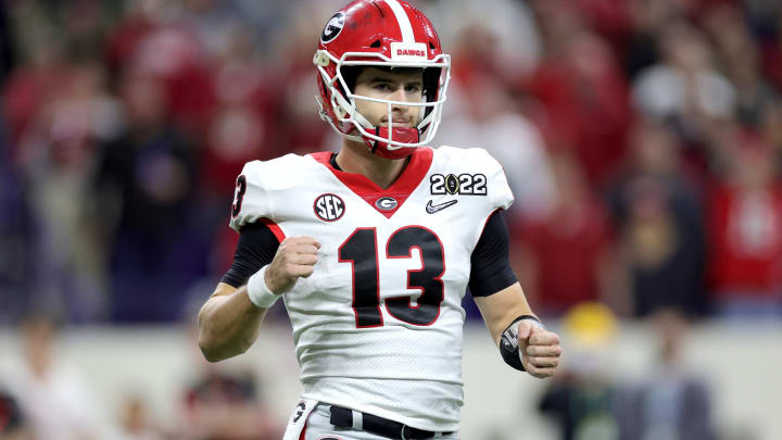 INDIANAPOLIS, INDIANA – JANUARY 10: Stetson Bennett #13 of the Georgia Bulldogs reacts after a touchdown in the third quarter of the game against the Alabama Crimson Tide during the 2022 CFP National Championship Game at Lucas Oil Stadium on January 10, 2022 in Indianapolis, Indiana. (Photo by Carmen Mandato/Getty Images)