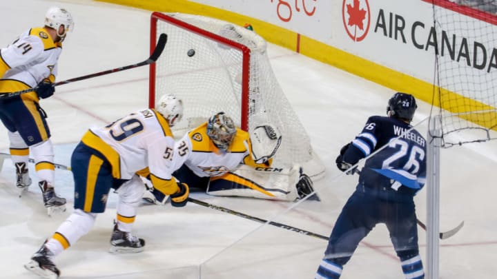 WINNIPEG, MB - MAY 1: Blake Wheeler #26 of the Winnipeg Jets watches as his shot gets behind goaltender Pekka Rinne #35 of the Nashville Predators for a third period goal in Game Three of the Western Conference Second Round during the 2018 NHL Stanley Cup Playoffs at the Bell MTS Place on May 1, 2018 in Winnipeg, Manitoba, Canada. (Photo by Jonathan Kozub/NHLI via Getty Images)