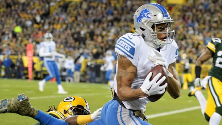 GREEN BAY, WI - NOVEMBER 06: Marvin Jones Jr. #11 of the Detroit Lions catches a pass for a touchdown past Davon House #31 of the Green Bay Packers in the first quarter at Lambeau Field on November 6, 2017 in Green Bay, Wisconsin. (Photo by Stacy Revere/Getty Images)