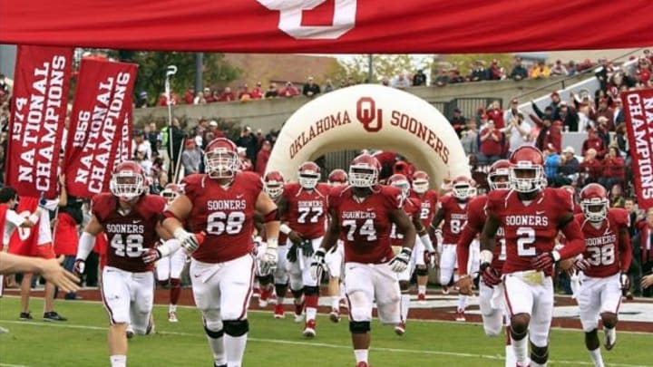 Oct 26, 2013; Norman, OK, USA; The Oklahoma Sooners run onto the field before the start of a game against the Texas Tech Red Raiders at Gaylord Family-Oklahoma Memorial Stadium. Mandatory Credit: Alonzo Adams-USA TODAY Sports
