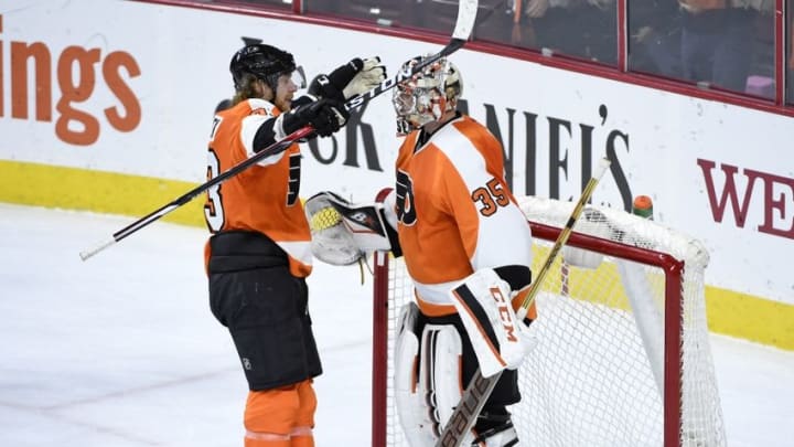 Feb 2, 2016; Philadelphia, PA, USA; Philadelphia Flyers right wing Jakub Voracek (93) and goalie Steve Mason (35) celebrate a win against the Montreal Canadiens at Wells Fargo Center. The Flyers defeated the Canadiens, 4-2. Mandatory Credit: Eric Hartline-USA TODAY Sports