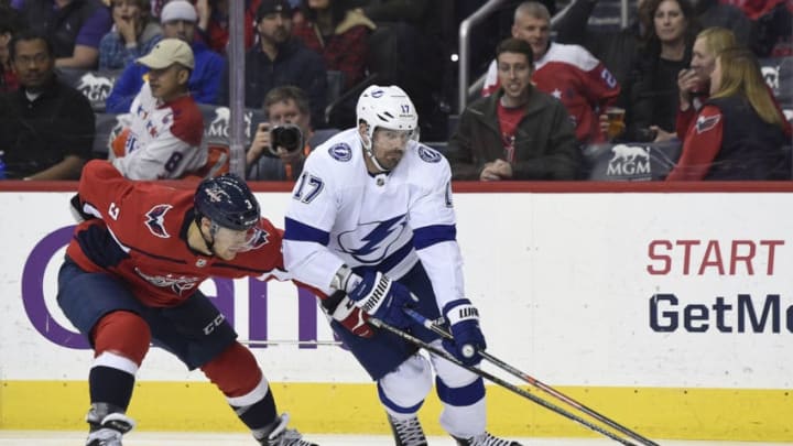 WASHINGTON, DC - MARCH 20: Alex Killorn #17 of the Tampa Bay Lightning skates with the puck against Nick Jensen #3 of the Washington Capitals in the second period at Capital One Arena on March 20, 2019 in Washington, DC. (Photo by Patrick McDermott/NHLI via Getty Images)