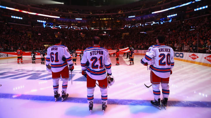 LOS ANGELES, CA – JUNE 13: (L-R) Rick Nash #61, Derek Stepan #21 and Chris Kreider #20 of the New York Rangers stand on the ice during the national anthem before Game Five of the 2014 Stanley Cup Final against the Los Angeles Kings at the Staples Center on June 13, 2014 in Los Angeles, California. (Photo by Dave Sandford/NHLI via Getty Images)