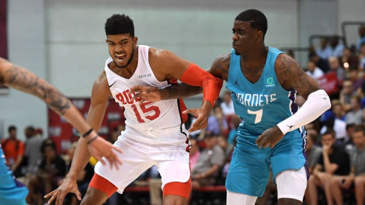 Could forward Chandler Hutchinson help the Denver Nuggets? Hutchinson dribbles against Jonathan Holmes during the first half of an NBA Summer League game at Cox Pavilion on 10 Jul. 2019. (Stephen R. Sylvanie-USA TODAY Sports)