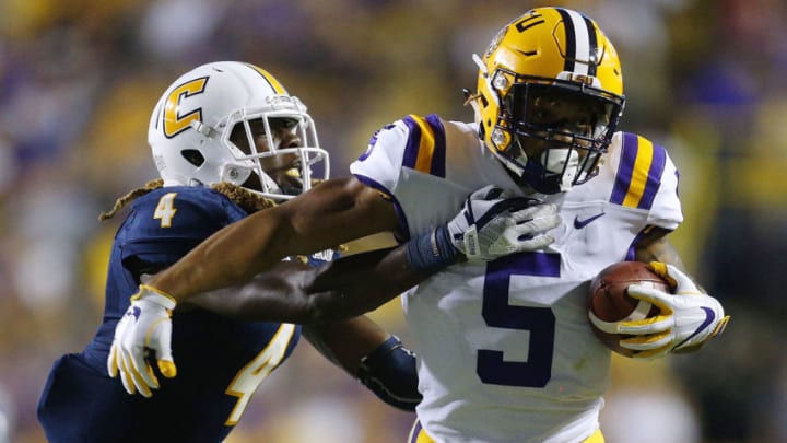BATON ROUGE, LA - SEPTEMBER 09: Derrius Guice #5 of the LSU Tigers runs with the ball as Tavon Lawson #4 of the Chattanooga Mocs defends during the second half of a game at Tiger Stadium on September 9, 2017 in Baton Rouge, Louisiana. (Photo by Jonathan Bachman/Getty Images)