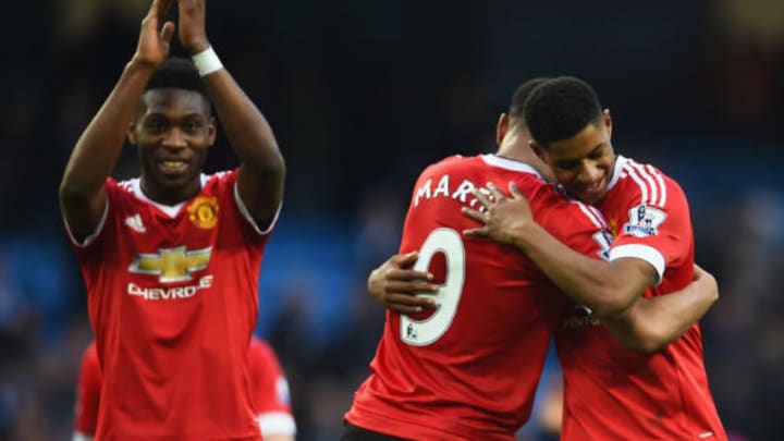 MANCHESTER, ENGLAND - MARCH 20: Winning goalscorer Marcus Rashford of Manchester United (R) and team mates Anthony Martial (C) and Timothy Fosu-Mensah celebrate victory after the Barclays Premier League match between Manchester City and Manchester United at Etihad Stadium on March 20, 2016 in Manchester, United Kingdom. (Photo by Laurence Griffiths/Getty Images)