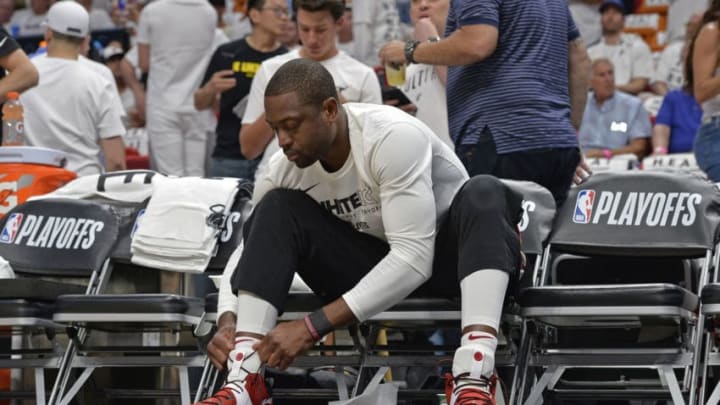 MIAMI, FL - APRIL 19: Dwyane Wade #3 of the Miami Heat ties shoes before the game against the Philadelphia 76ers in Game Three of Round One of the 2018 NBA Playoffs on April 19, 2018 at American Airlines Arena in Miami, Florida. NOTE TO USER: User expressly acknowledges and agrees that, by downloading and or using this Photograph, user is consenting to the terms and conditions of the Getty Images License Agreement. Mandatory Copyright Notice: Copyright 2018 NBAE (Photo by David Dow/NBAE via Getty Images)