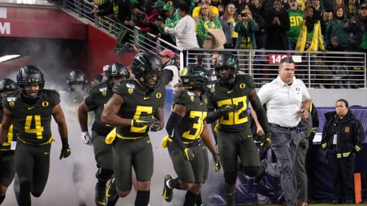 SANTA CLARA, CALIFORNIA - DECEMBER 06: Head coach Mario Cristobal of the Oregon Ducks runs onto the field with his team prior to the start of the Pac-12 Championship game against the Utah Utes at Levi's Stadium on December 06, 2019 in Santa Clara, California. (Photo by Thearon W. Henderson/Getty Images)