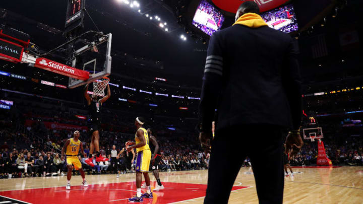 LOS ANGELES, CALIFORNIA - APRIL 05: Shai Gilgeous-Alexander #2 of the Los Angeles Clippers dunks the ball as LeBron James #23 of the Los Angeles Lakers looks on during the fourth quarter at Staples Center on April 05, 2019 in Los Angeles, California. NOTE TO USER: User expressly acknowledges and agrees that, by downloading and or using this photograph, User is consenting to the terms and conditions of the Getty Images License Agreement. (Photo by Yong Teck Lim/Getty Images)