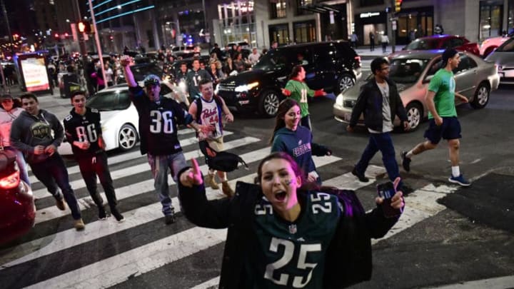 PHILADELPHIA, PA - JANUARY 21: Fans pass on North Broad Street reacting to the Eagles' win near City Hall on January 21, 2018 in Philadelphia, Pennsylvania. The Philadelphia Eagles defeated the Minnesota Vikings 38-7 in the NFC Championship game. (Photo by Corey Perrine/Getty Images)
