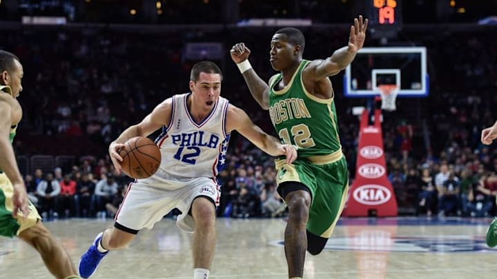 Mar 20, 2016; Philadelphia, PA, USA; Philadelphia 76ers guard T.J. McConnell (12) drives toward the net as Boston Celtics guard Terry Rozier (12) defends during the second quarter of the game at the Wells Fargo Center. Mandatory Credit: John Geliebter-USA TODAY Sports