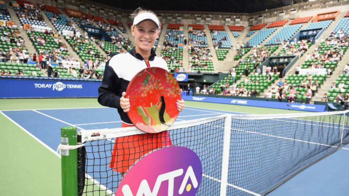 TOKYO, JAPAN - SEPTEMBER 24: Caroline Wozniacki of Denmark poses with the winners trophy after defeating Anastasia Pavlyuchenkova of Russia in the women's singles final match on day seven of the Toray Pan Pacific Open Tennis At Ariake Coliseum on September 24, 2017 in Tokyo, Japan. (Photo by Matt Roberts/Getty Images)