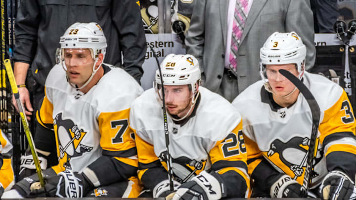 SAN JOSE, CA - JANUARY 15: Pittsburgh Penguins Defenceman Jack Johnson (73), Pittsburgh Penguins Defenceman Marcus Pettersson (28) and Pittsburgh Penguins Defenceman Olli Maatta (3) anxiously waiting to get on the ice during the game between the Pittsburg Penguins and the San Jose Sharks on Tuesday, January 15, 2019 at the SAP Center in San Jose, CA. (Photo by Douglas Stringer/Icon Sportswire via Getty Images)